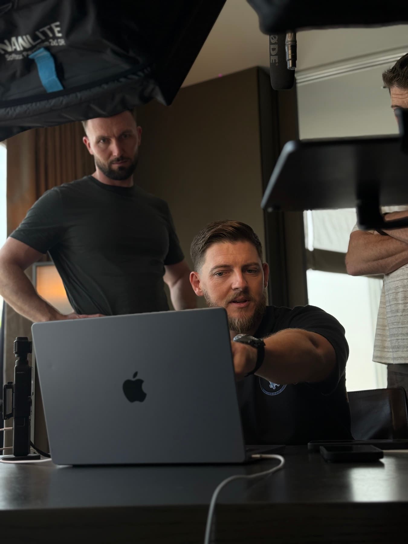 Owen Morton at work — building in public, mid-shoot at his laptop